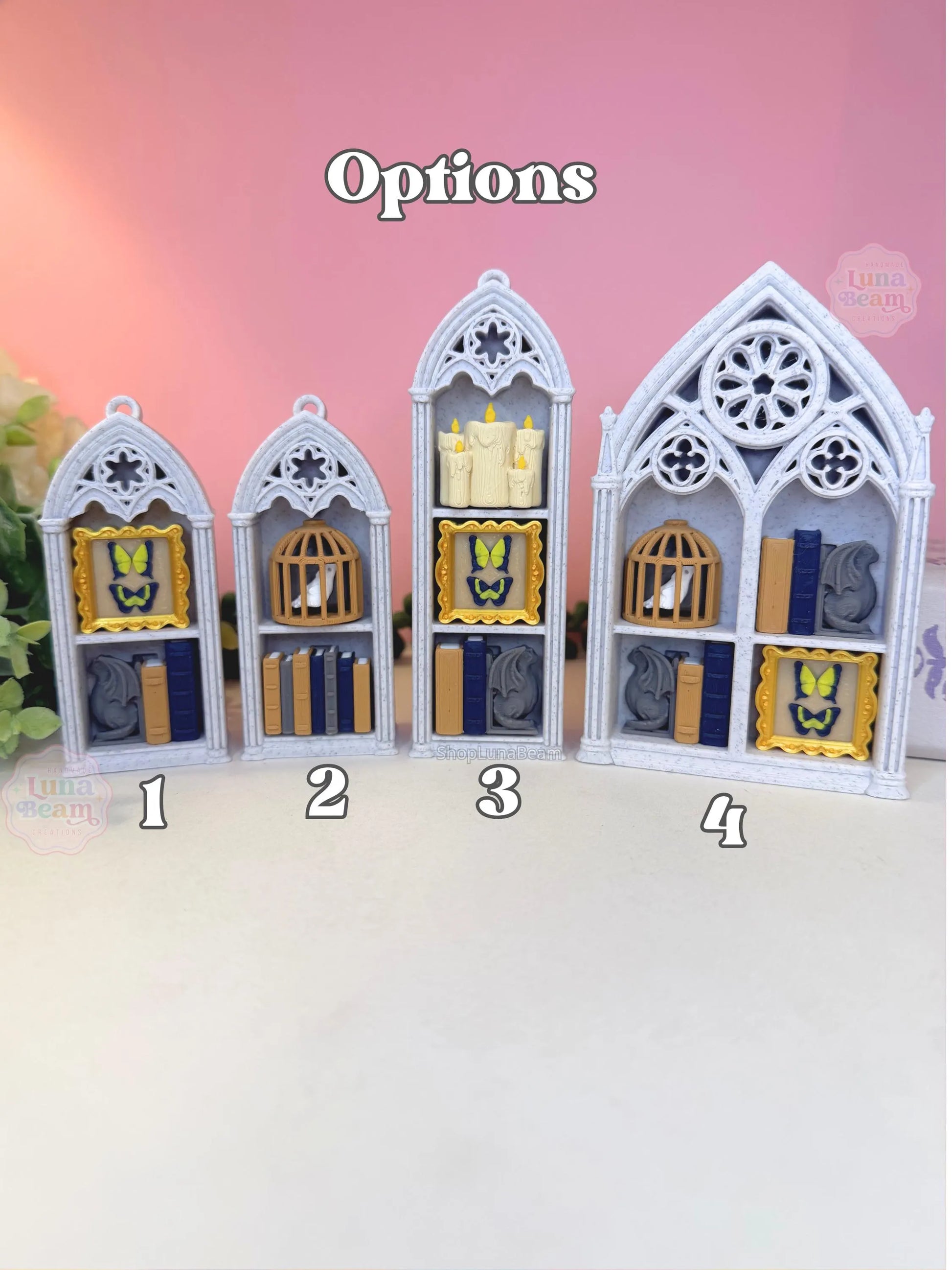 Four gothic-style display cases with different interior arrangements on a pink background.
