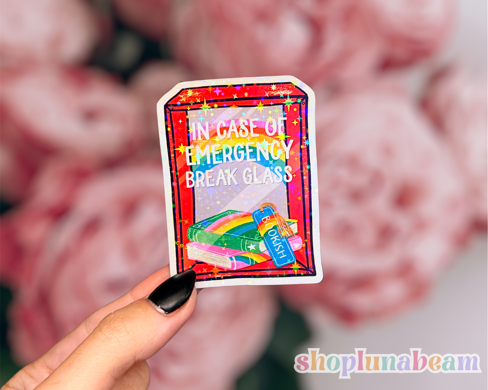 Colorful card with 'In case of emergency, break glass' text held by a hand against a blurred background.